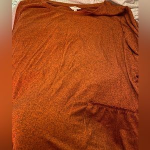 Burnt orange long sleeve ruffle hem shirt